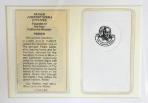 A first-class relic — a sliver of bone and coffin beneath the seal of this prayer card — of St. Junipero Serra was displayed at St. Xavier High School last week.