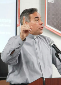 Deacon Scott Haner spoke to students at the annual Catholic Relief Services (CRS) Rice Bowl kick-off luncheon held Feb. 2 at DeSales High School. Deacon Haner talked about his recent trip to the Balkans as a CRS global ambassador. (Record Photos by Jessica Able)