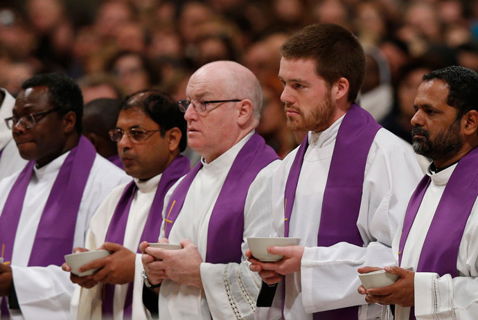 Priests who are “missionaries of mercy” for the Holy Year held bowls of ashes as Pope Francis celebrated Ash Wednesday Mass in St. Peter’s Basilica at the Vatican Feb. 10. (CNS Photo by Paul Haring)