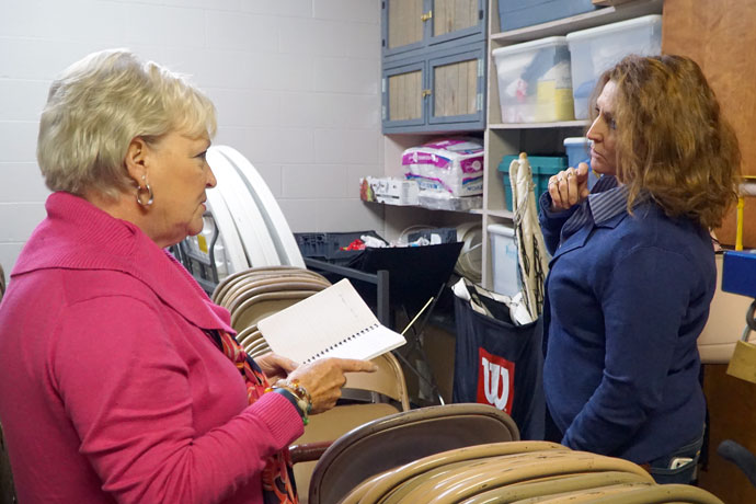 Elaine Alicna, left, and Cheri Ellis-Reeves, parishioners of St. James Church in Elizabethtown, Ky., took stock of paper products Nov. 14 in preparation for the parish’s annual Thanksgiving meal, which serves hundreds of people. (Record Photo by Jessica Able)