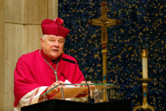 Miami Archbishop Thomas G. Wenski gives the meditation during a prayer service in early September at Holy Family Church in New York City. Archbishop Wenski says that for there to be an enduring economic revival, all segments of society must work together to provide good-paying jobs and support those unable to support themselves.(CNS photo/Gregory A. Shemitz)