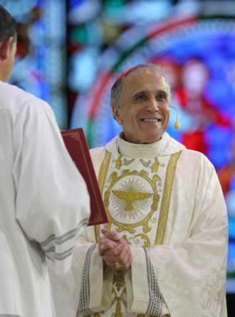 Cardinal Daniel N. DiNardo of Galveston-Houston, president of the U.S. Conference of Catholic Bishops, smiles as he concelebrates the closing Mass July 4 at the "Convocation of Catholic Leaders: The Joy of the Gospel in America" in Orlando, Fla. Leaders from dioceses and various Catholic organizations gathered for the July 1-4 convocation. (CNS photo/Bob Roller) See CONVOCATION-MASS-CLOSING July 4, 2017.