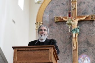 Jesuit Brother Guy Consolmagno, director of the Vatican Observatory, urged an audience at Sts. Peter and Paul Church in Hopkinsville, Ky., Aug. 20 that celestial events such a total solar eclipse are a wonder of God’s creation meant to be enjoyed. Brother Consolmagno was in Hopkinsville to view the Aug. 21 eclipse. (CNS photo/Dennis Sadowski)