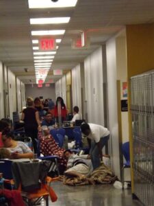 People bed down in the hallways of Largo High School in Largo, Fla., as they await Hurricane Irma Sept. 10. (CNS photo/Mickey Conlon)