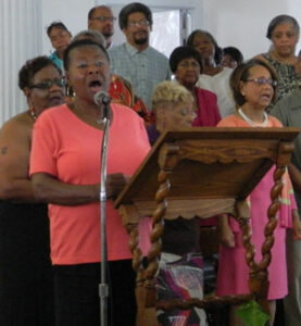 A choir led the music during a Mass to celebrate St. Augustine Church’s 145th anniversary Aug. 23. Some members of the choir and their families have been lifelong members of the church, which is located at 13th Street and West Broadway. (Record Photo by Ruby Thomas).