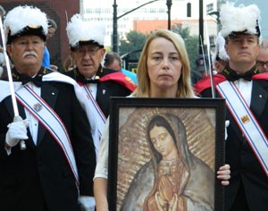 The Knights of Columbus and an image of Our Lady of Guadalupe, held by Karen Schneider, led the Helpers of God’s Precious Infants’ procession Aug. 8. Record Photo by Marnie McAllister