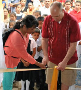 Joy and Wesley Martin  cut the ribbons during a ceremony to inaugurate John Paul II Church.