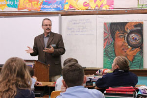 Marc Bouchard of Catholic Charities spoke to St. Catherine Academy students about the work of the Migration and Refugee Services.