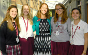 Abby Asfahl, center, guidance counselor and moderator of the Green Dot Club with the club's officers.  (Record photo by Ruby Thomas)