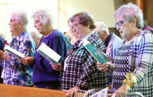 Religious sisters sang the opening hymn, "Lead Me, Guide Me," during a Mass to celebrate World Day of Consecrated Life Feb. 7 (Record Photo by Ruby Thomas)