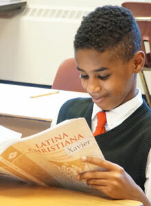 A student reads during Latin class. (Record Photo by Ruby Thomas)