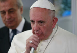 Pope Francis answers questions from journalists aboard his flight from Ciudad Juarez, Mexico, to Rome Feb. 17. (CNS photo/Paul Haring) 