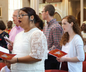 Nina Espinueva, a parishioner at St. Martin of Tours Church, took part in the Pentecost celebration. (Record Photo by Ruby Thomas)