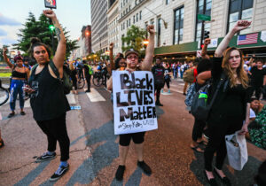 People in Chicago demonstrate July 11 after a string of nationwide police shootings of African-Americans and the slaying of police officers in Dallas. Around the country, Catholic organizations, parishes, clergy and laity are taking action and bolstering efforts to build peace and battle racism, following a summer of violence. (CNS photo/Tannen Maury, EPA)