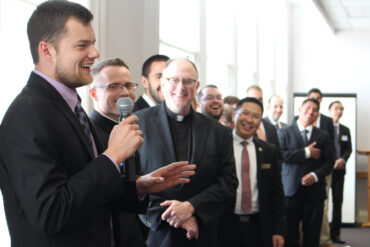 Seminarian David Ferrell discussed his summer assignment as his fellow seminarians looked on during an annual luncheon sponsored by Serra Club on Aug. 11.