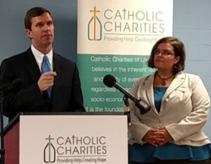 Attorney General Andy Beshear, left, and Marissa Castellanos of Catholic Charities announced Oct. 14 that their offices will share a $1.5 million federal grant to combat human trafficking. (Photo Special to The Record)