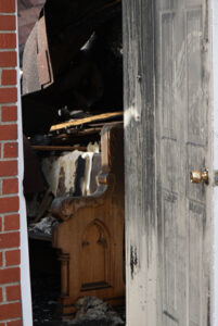 Part of the collapsed roof rested on a pew inside Our Lady of the Caves Church in Horse Cave, Ky., on Dec. 11, two days after an early morning fire engulfed the church. An investigation into the cause is still ongoing. Parishioners are attending Mass in the parish hall next door to the church building. (Record Photo by Ruby Thomas)