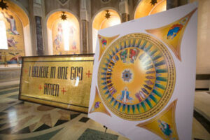 A depiction of what the completed Trinity Dome will look like at the National Shrine of the Immaculate Conception in Washington is seen July 13. The preliminary piece of mosaic fabricated for the dome was blessed by Pope Francis during his visit to the National Shrine Sept. 23, 2015. (CNS photo/Tyler Orsburn)